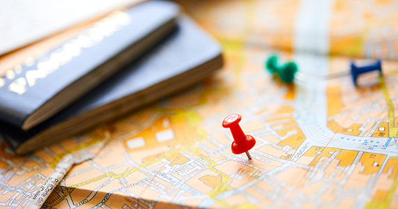 Tavel planning items on a map of the world