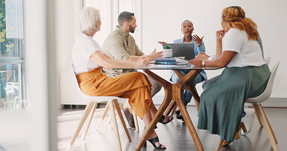 group of coworkers attending a leadership development meeting