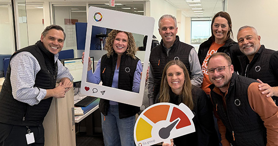 Group of employees celebrating positive company culture
