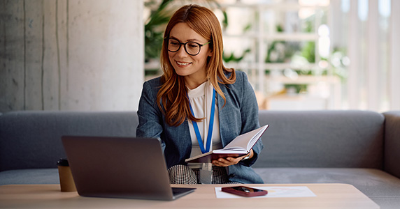 woman managing customer data using customer loyalty platform