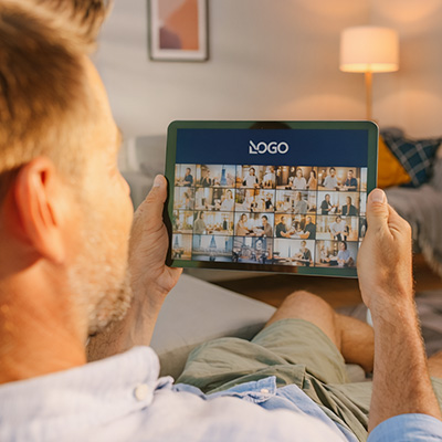 incentive trip attendee looking at post-event photo gallery on ipad