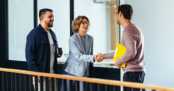 woman shaking hands with channel partner