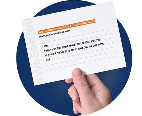 manager holding recognition card