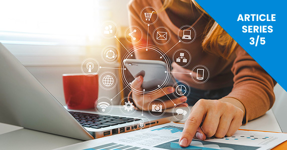 woman looking at chart and comparing incentive data on her mobile device